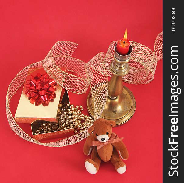 Christmas candle with flame.Red background. Christmas candle with flame.Red background.