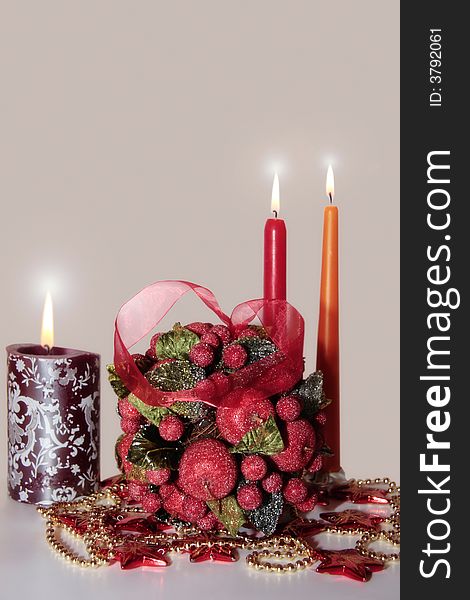 Kissing ball against a white background with candles. Kissing ball against a white background with candles