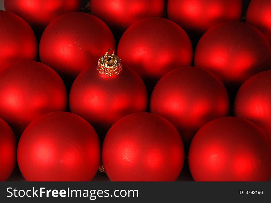 Background with red Christmas decorations and one close-up ball