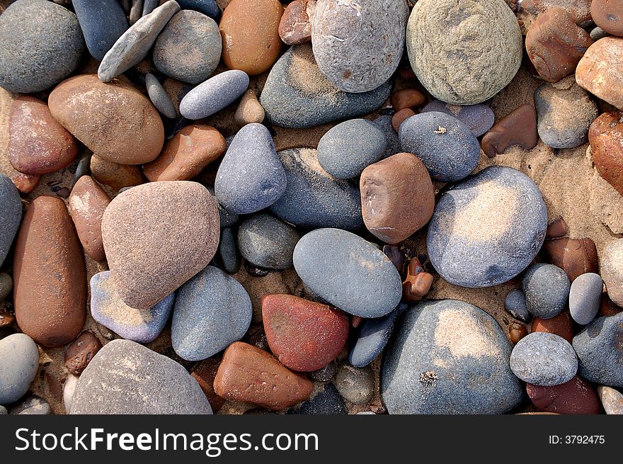 Lots of different color pebbles on the beach