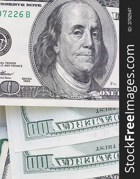 Pile of crisp $100 dollar bills with President Franklins face on top close-up. Pile of crisp $100 dollar bills with President Franklins face on top close-up.