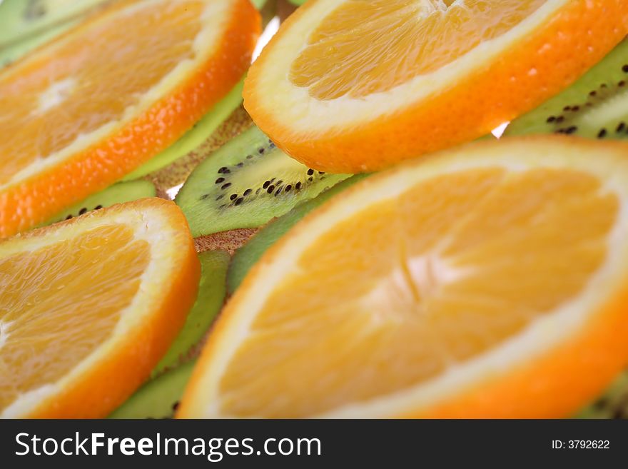 Orange and kiwi slices background