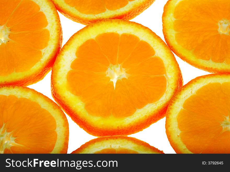 Slices of fresh oranges background. Slices of fresh oranges background
