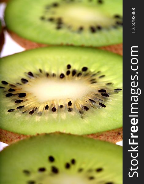 Slices of fresh kiwi background. Slices of fresh kiwi background