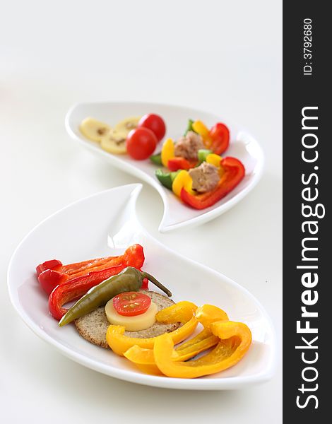 Healthy colorful platter with assorted vegetables on fancy white china. Healthy colorful platter with assorted vegetables on fancy white china