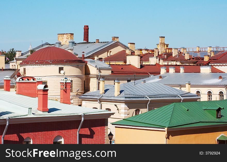 Urban landscape. Sunny roofs of old town.