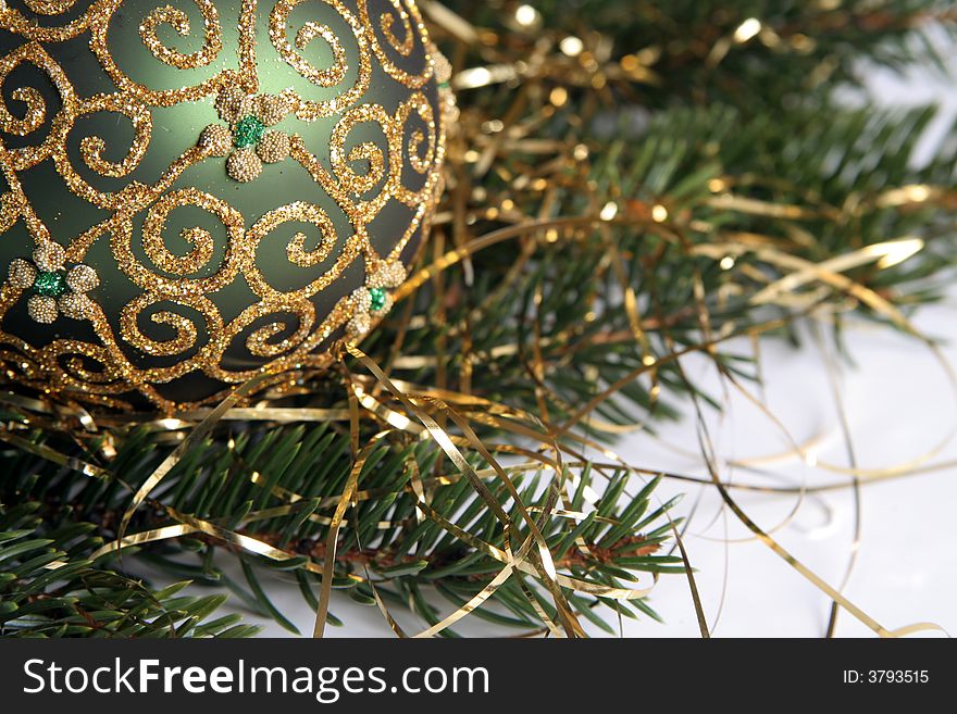 Christmas balls with gold ornament on the green pine branches. Christmas balls with gold ornament on the green pine branches