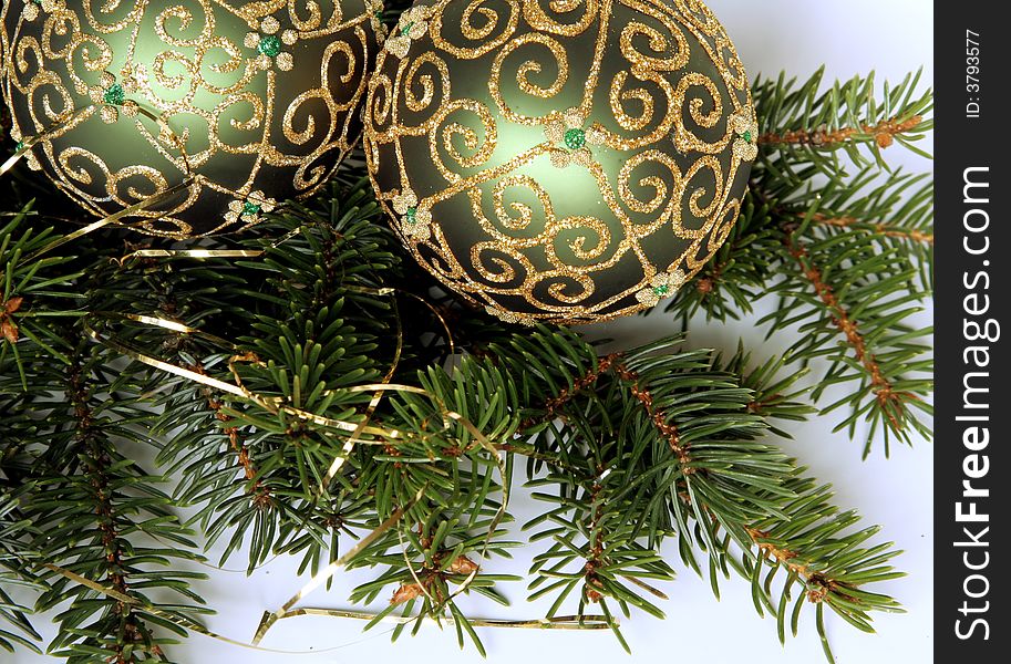 Christmas balls with gold ornament on the green pine branches. Christmas balls with gold ornament on the green pine branches