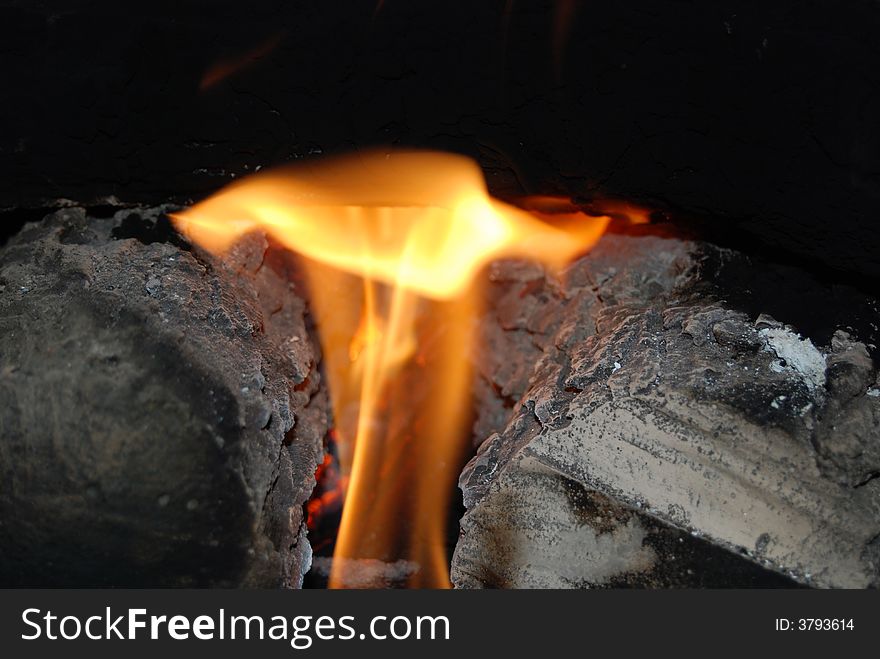 Warm fire glowing in the fireplace. Warm fire glowing in the fireplace.