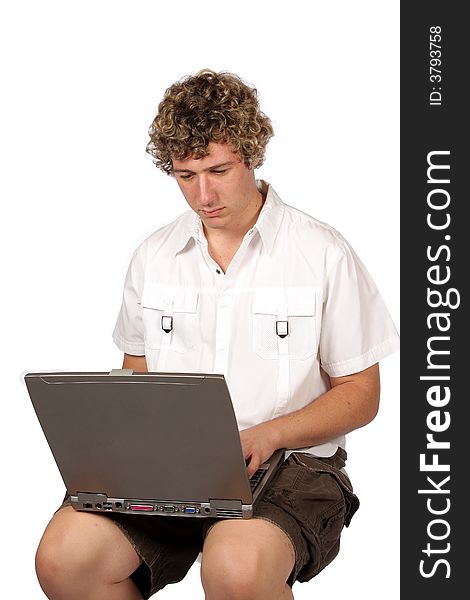 Yuppie working with laptop on his lap