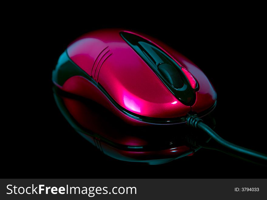 Computer mouse on reflective background closeup