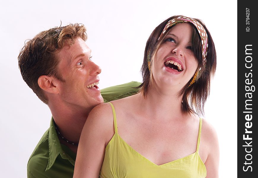 Young adult couple wearing green and having fun. Young adult couple wearing green and having fun