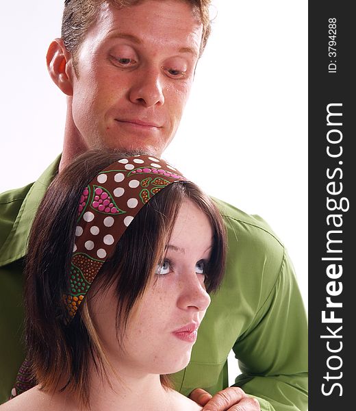 Young adult couple wearing green and having fun. Young adult couple wearing green and having fun