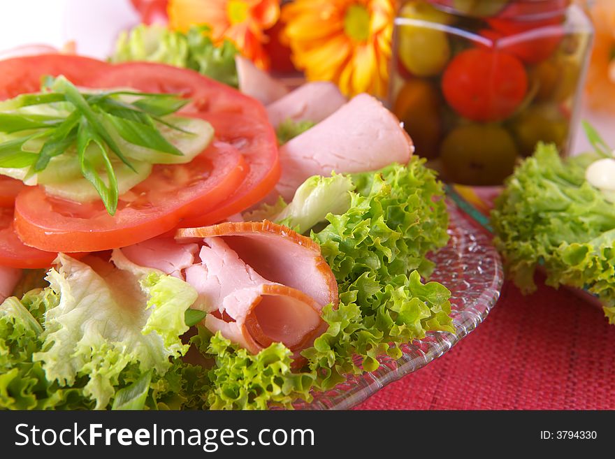 Fresh salad with onion, tomato and basil