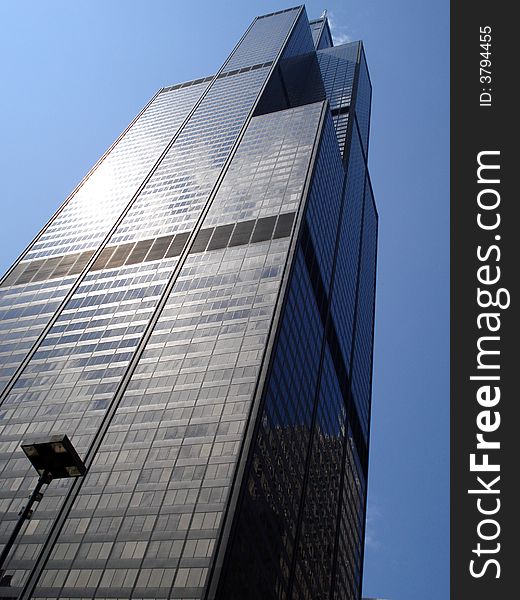 A skyscrapper in Chicago towers over the city. A skyscrapper in Chicago towers over the city.