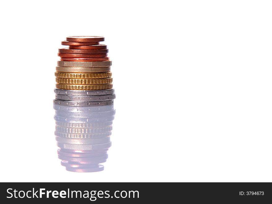 Stack of euro coins isolated over white background, with reflection