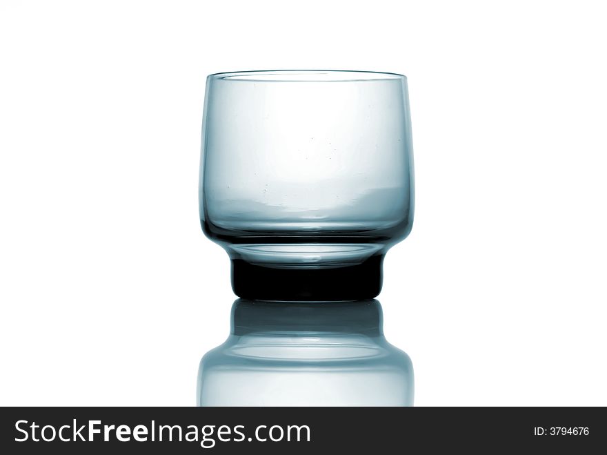 Blue glass isolated over white background, with reflection