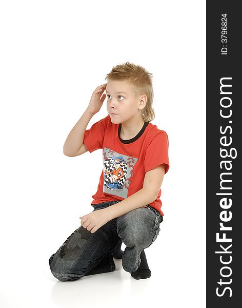 The sitting boy on a white background. The sitting boy on a white background