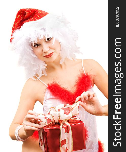 Beautiful young woman wearing santa hat with gift. Beautiful young woman wearing santa hat with gift