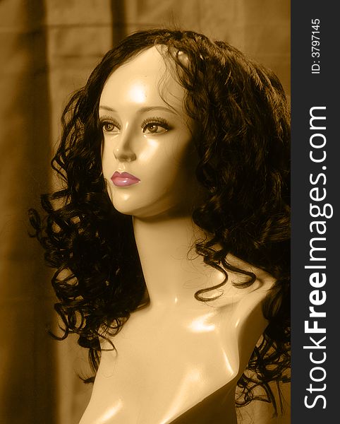 Still life sepia mannequin with soft pink lips. Still life sepia mannequin with soft pink lips