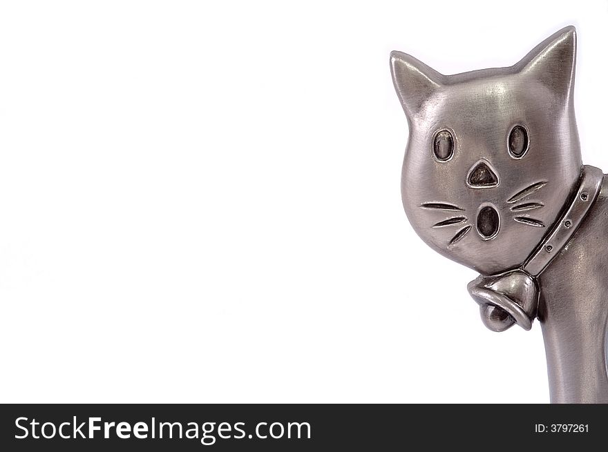 Head of a metal toy cat isolated on white. Close-up.