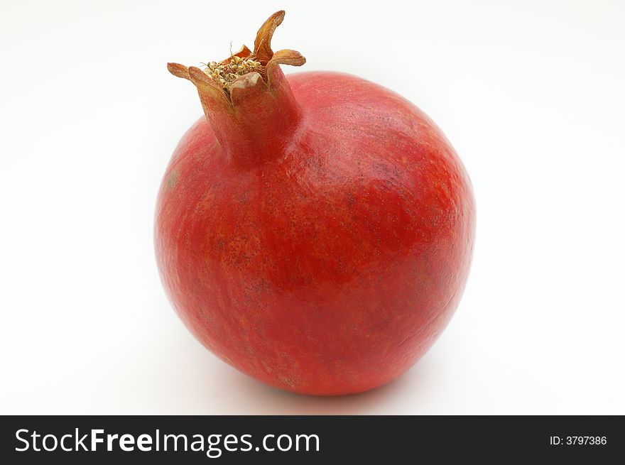 Ripe pomegranate on white isolated