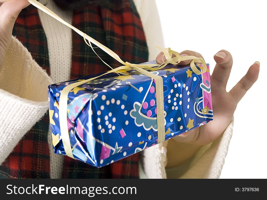 Girl unwrapping her christmas gift. Girl unwrapping her christmas gift
