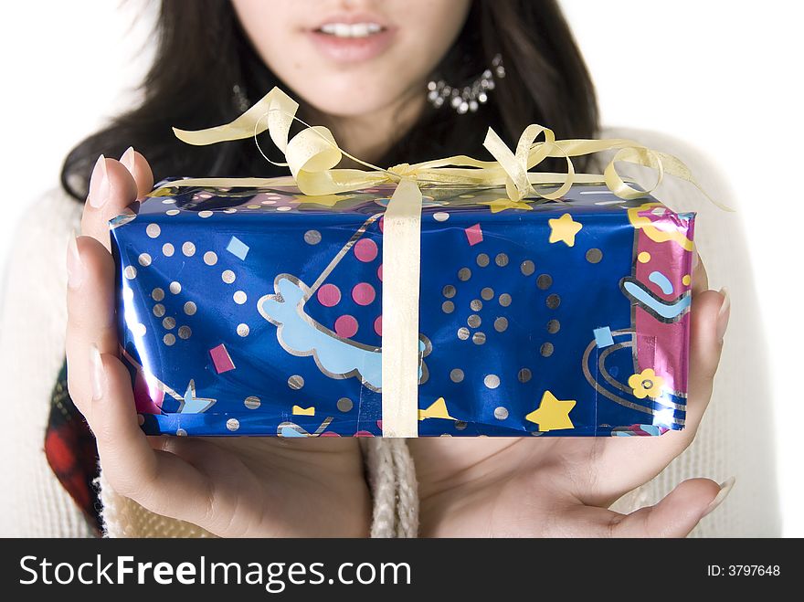 Girl holding her christmas gift. Girl holding her christmas gift