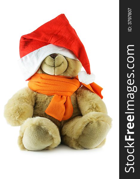 Teddy bear with big Santa hat isolated over a white background