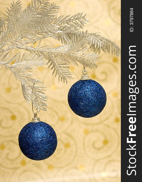 Blue Christmas balls on golden background