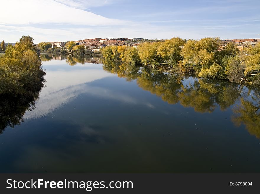 Tormes river across Salamanca city, Spain. Tormes river across Salamanca city, Spain.