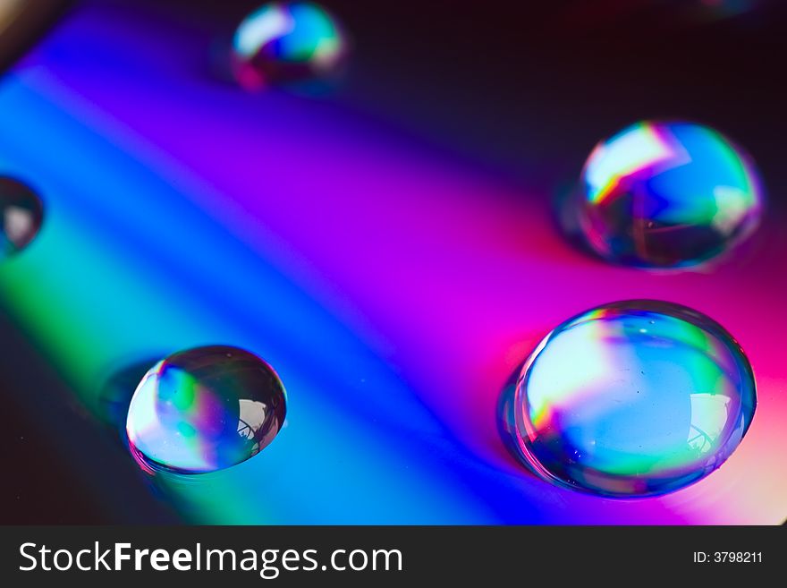 Macro of drops of water on a dvd disk. Macro of drops of water on a dvd disk