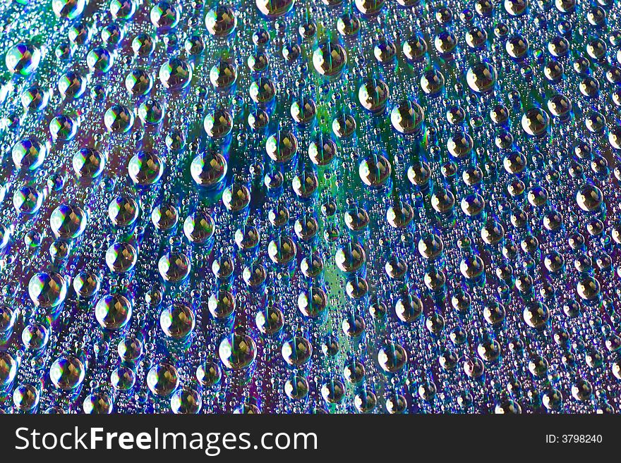 Macro of drops of water on a dvd disk. Macro of drops of water on a dvd disk