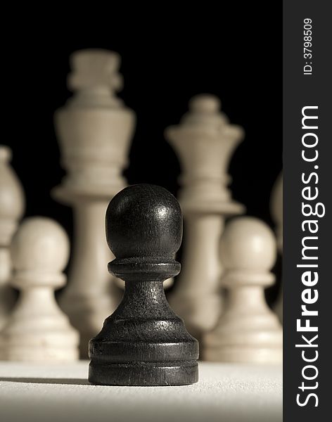 Black pawn against white pieces.