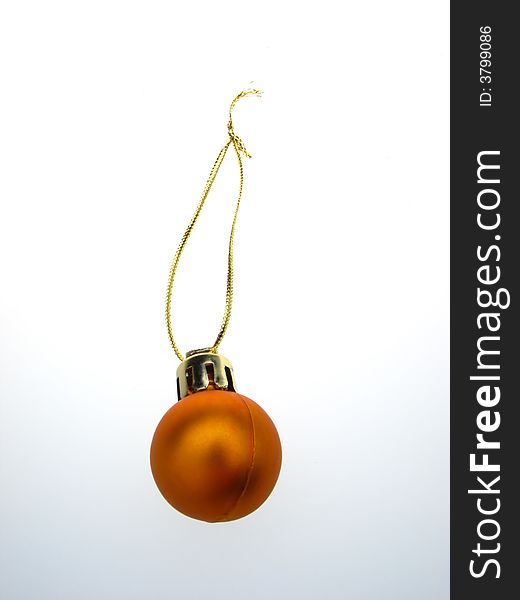Fur-tree toy, orange - golden sphere on  white background. Fur-tree toy, orange - golden sphere on  white background