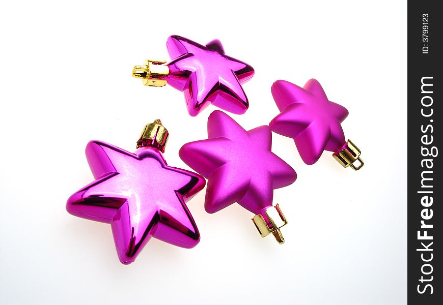 Fur-tree toys an ornament of an asterisk of lilac color on  white background. Fur-tree toys an ornament of an asterisk of lilac color on  white background