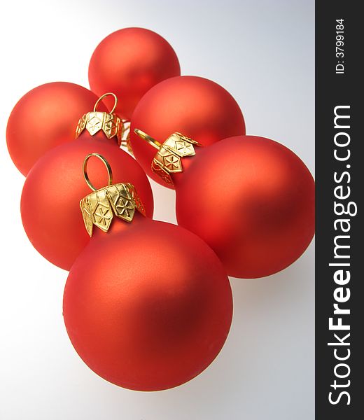 Fur-tree toys spheres of red color on  white background. Fur-tree toys spheres of red color on  white background