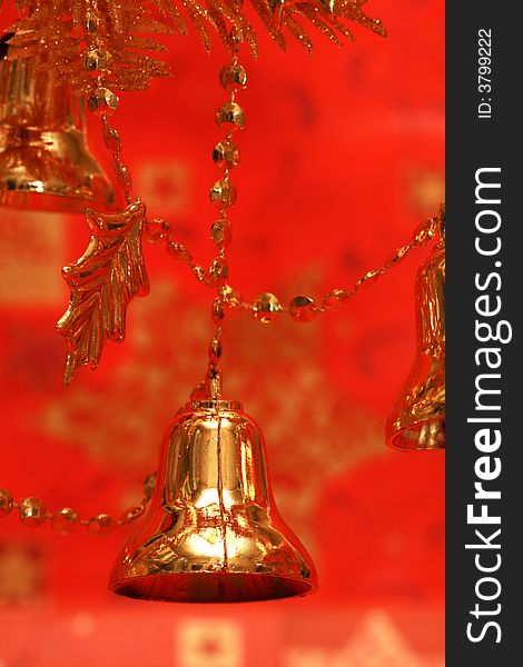 New-year handbells and Christmas tree on red background