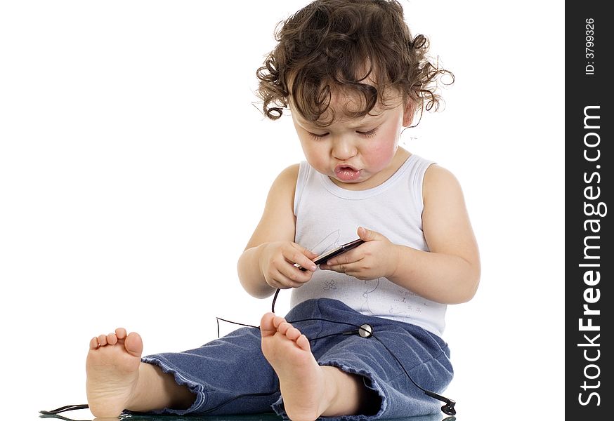 Child with mp 3 player,isolated on a white background. Child with mp 3 player,isolated on a white background.