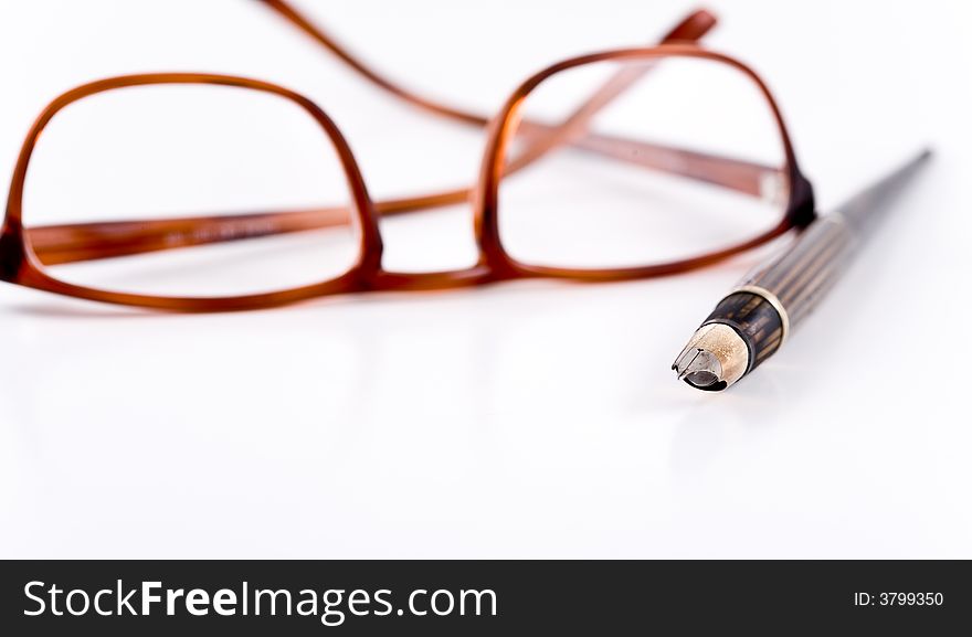 Glasses And Pen.