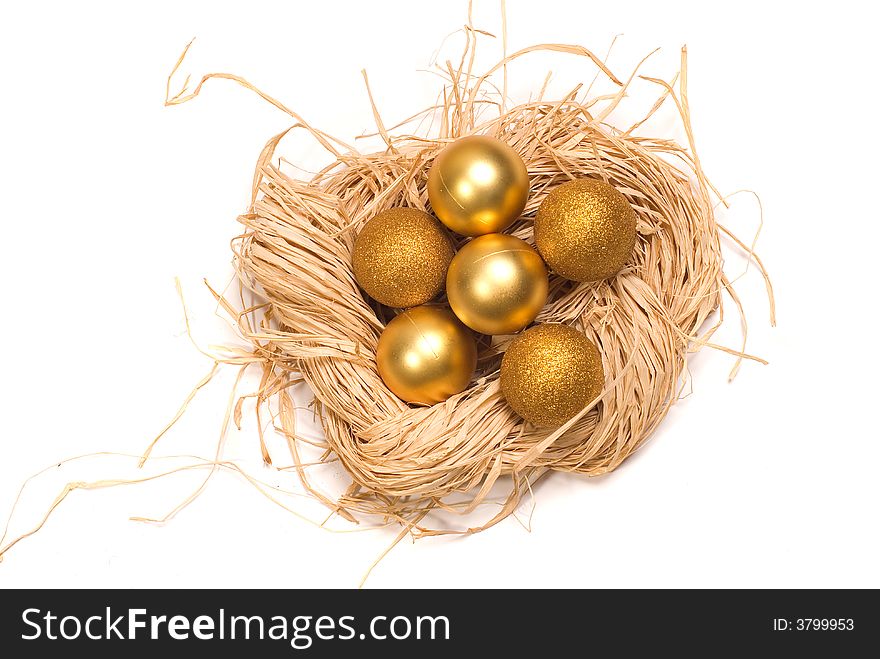 Basket with gold eggs and a New Year's toy. Basket with gold eggs and a New Year's toy