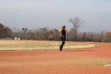 Athletic Young Woman Running At The Track Stock Photography