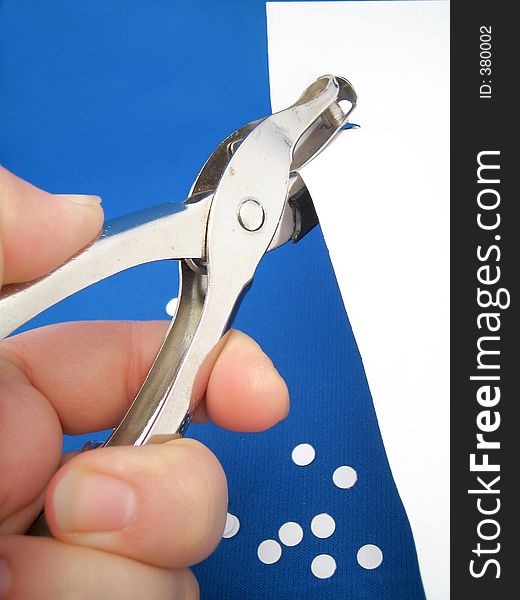 Closeup of paper hole puncher
