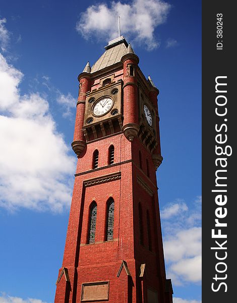 Old bright clock tower against blue sky. Old bright clock tower against blue sky