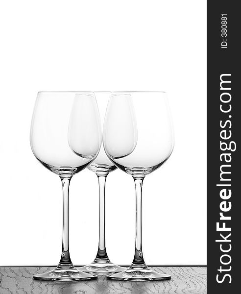 Three wine glasses in backlight