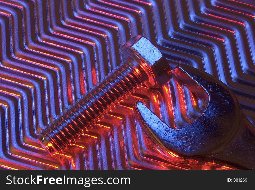 Tools on metal plate under low light. Tools on metal plate under low light.