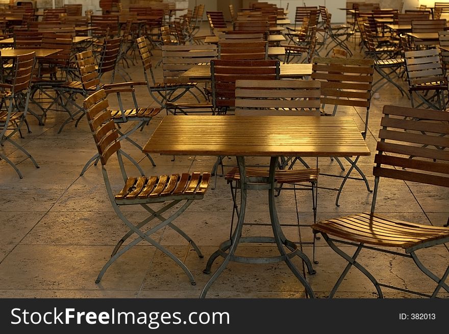 Large group of empty cafe table and chairs. Large group of empty cafe table and chairs.