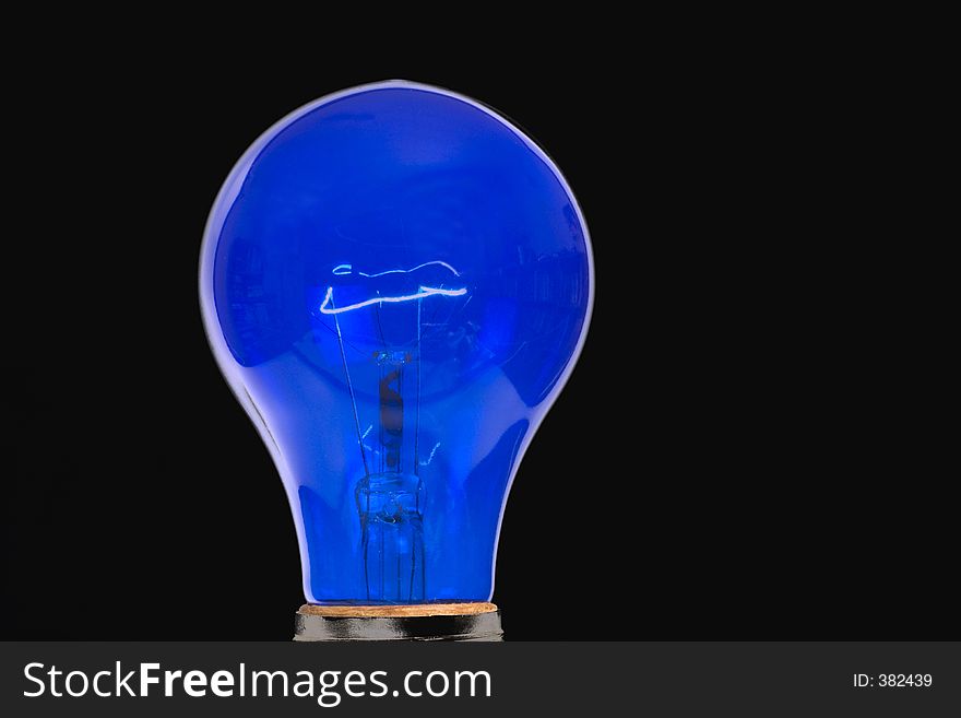 Blue light bulb - black background. Blue light bulb - black background