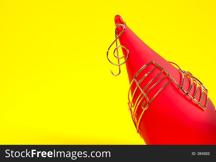 Red Christmas Ornament on a Yellow Background