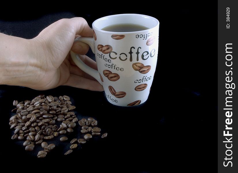 Isolated hand and coffee beans. Isolated hand and coffee beans